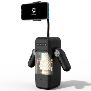 Den eleganta svarta Elon Masturbator, med två armar och ett genomskinligt fack, visar avancerad teknik. En smartphone på toppen visar MasturbaDron-logotypen, vilket antyder dess avancerade vibrationslägen.