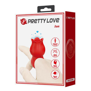 Fingervibrator i rosa silikon i detaljhandelsförpackning, med en böjd design för riktad stimulering.