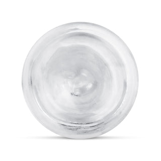 Toppvy av det runda, silverfärgade metallocket med en slät, lätt konkav yta och subtil struktur - liknande den eleganta finishen på en Jelly Dildo 14 cm Utan Pung.