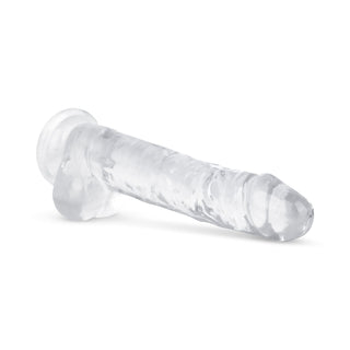 Jelly Dildo 19 cm Med Pung med utsvängd bas ligger på en vit yta, utformad för realistisk vaginal och anal stimulans.