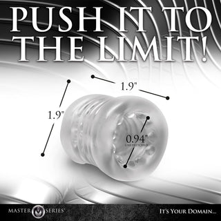 Transparent Ball Stretcher XR: Klar ribbad silikonhylsa med märkta mått på en metallisk bakgrund. Text: "PUSH IT TO THE LIMIT!" Har texturerad insida för extra stimulans och hjälper till att fördröja orgasm.