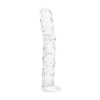 En genomskinlig dildo av texturerat glas, 19 cm lång, med upphöjda räfflor, som står upprätt på en vit yta.