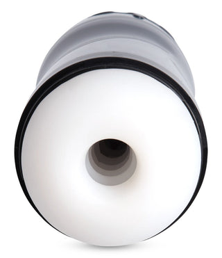 En närbild av Masturbator - Sugande Effekt - Rebel, som visar sin runda, genomskinliga svartvita design med ett ihåligt centrum, som påminner om modern elegans i sofistikerade enheter.