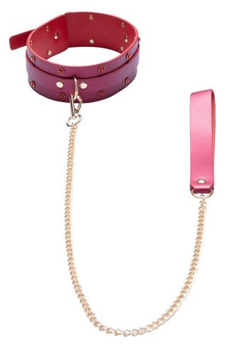 Luxury Pearl Bondage Kit har ett rött läderhalsband med guldnitar och en matchande guldkedja - perfekt att kombinera med handfängsel eller ett bondage-set för en elegant, samordnad look.