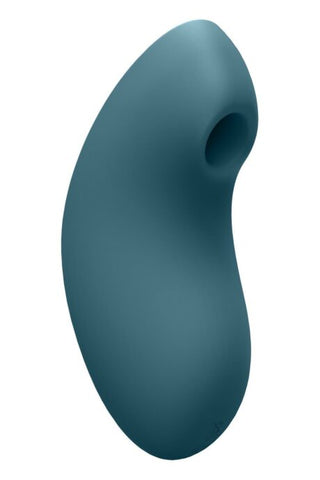 Vulvastimulator i mörkt blågrön silikon, bönformad med en liten cirkulär öppning upptill.