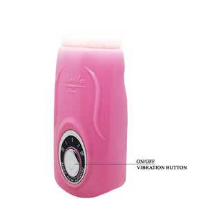 Rosa handhållen vibrator med vridreglage, på/av-knapp och texturerad framsida; tillverkad av slätt material.