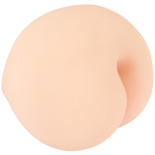 Persikofärgad onaniprodukt i silikon med rundad form och en skåra i mitten.