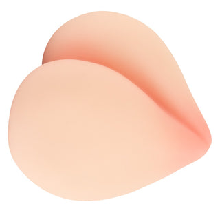 Hjärtformad, persikofärgad onaniprodukt tillverkad av Nature Skin-material.