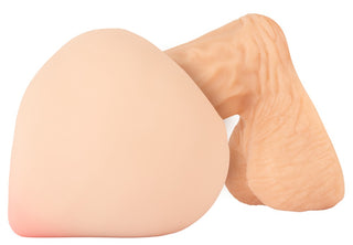 En persikformad Nature Skin-masturbator med en anatomiskt utformad penisinsats.