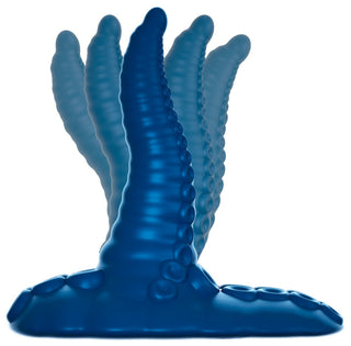 Tentacle Pad Sit On Vibrator, en blå silikonvibrator med sugfot, visas i flera positioner för att visa flexibilitet och handsfree stimulans.