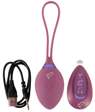 Fjärrstyrd knipkula med kontrollenhet och USB-kabel i rosa silikon, visas på vit bakgrund.