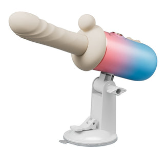 Monterad stötvibrator med en köttfärgad silikonspets och en blå-rosa cylindrisk bas.