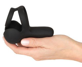 Svart, böjd silikonmassager för mellangården från Rebel.