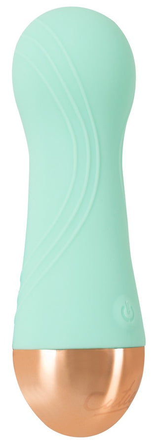 Mintgrön Cuties-minivibrator med dubbel densitet, kopparfärgad metallbas och strömsymbol.