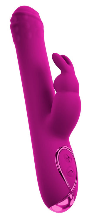 Fuchsiafärgad kaninvibrator med roterande kulor, strukturerad spets och kontrollknappar i metall på basen.