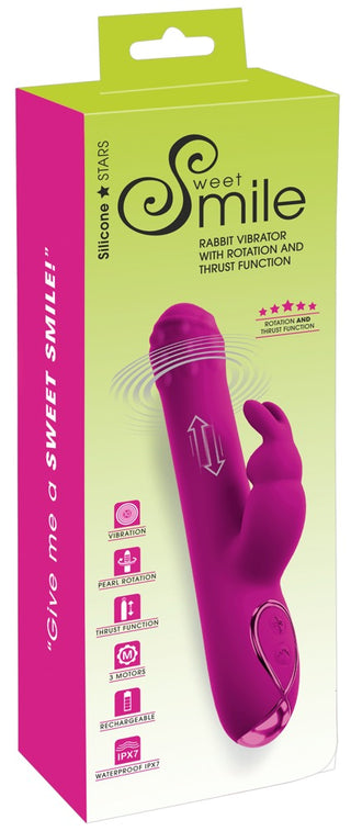 Lila kaninvibrator med roterande kulor, silikonstruktur samt rotations- och stötfunktioner, förpackad i en grön låda.