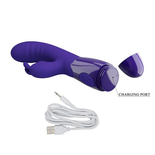 Cerberus Licking Rabbitvibrator i lila med laddningsporten synlig och en vit USB-kabel placerad under den för effektiv G-punktsstimulering.