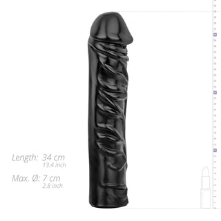 Realistisk XXL Dildo 33 cm, i djupsvart, står upprätt bredvid måtten som visar dess imponerande storlek – perfekt för extrem njutning och intensiv stimulans.