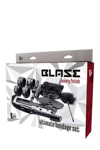 Box of Blaze BDSM Full Set, med begränsningar och handbojor mot en geometrisk bakgrund.