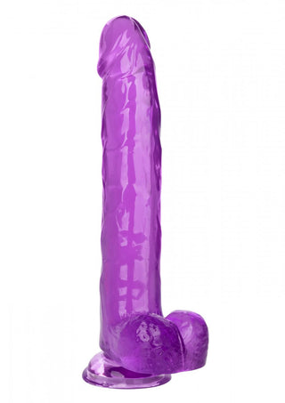 Queen Size Dildo 25cm är en lila genomskinlig silikonleksak med en realistisk design, definierat huvud och ådrande struktur. Den har en rundad, platt bas för stabilitet.