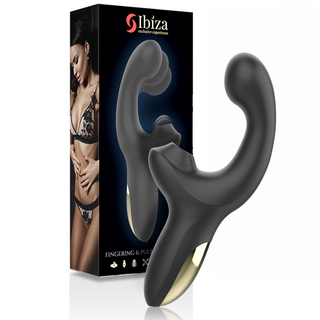 Svart dubbelstimulerande vibrator med guldaccent, tillverkad av slätt material, visas bredvid sin förpackning.