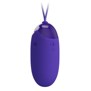 Ett litet, lila, ovalformat Pretty Love Berger Vibratorägg med sladd och knappar märkta DC och M.