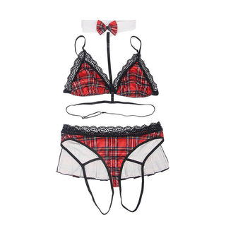 Subblime Sexy Schoolgirl Outfit innehåller ett rött rutigt underklädesset med en triangel bralette med sensuella spetsdetaljer, en matchande stringtrosa med en volangkjol och en choker prydd med en röd rutig fluga, vilket ger lekfullhet till klassisk tjusning.