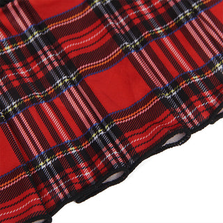 Närbild av Subblime Sexy Schoolgirl Outfit i ett rött rutigt tyg, med korsande svarta, vita och gula linjer med en traditionell tartandesign som har ett strukturerat utseende och livfulla färgkontraster.
