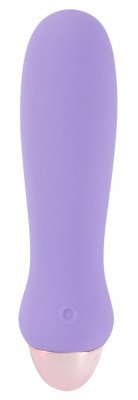 En lila, cylindrisk vibrator med namnet "Cuties - Vibrator 12 cm," med en rundad rosa spets och slätt silikonmaterial, vilar på en vit bakgrund.