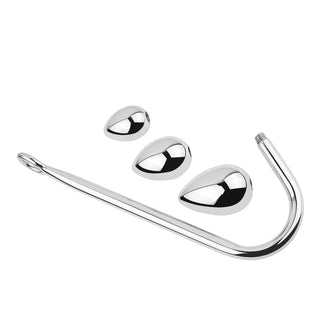 Analhake i metall med utbytbara kulor, silverfärgad, mot en vit bakgrund.