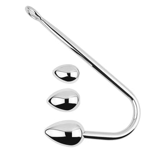 Metallisk analkrok med böjt handtag och tre utbytbara kulor i varierande storlekar.