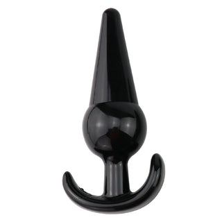 T-Plug 12 Buttplug är en svart, konformad analplugg i silikon som mäter 12 cm, har en utsvängd bas och ett böjt handtag för säker och bekväm användning.