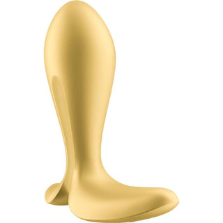 Vi introducerar en skulpturell stol i guld med en böjd, abstrakt design och slät finish, som påminner om de eleganta konturerna som finns i Satisfyer Intensity Plug App, och blandar konst och innovation sömlöst.