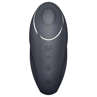 Grå handhållen vibrator i silikon med tre kontrollknappar och metalldetaljer.